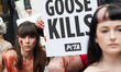 Activists from People for the Ethical Treatment of Animals (PETA) lie nearly naked and cov...