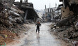A child plays during the devastating loss Alamtarb neighborhood in Shijia neighborhood, an...