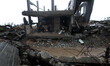 Palestinians set fire inside their house destroyed, witnesses said he was hit by Israeli s...