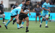 Zach Kibirige of Newcastle breaks through the Worcester defence to score their 1st try dur...