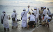 Balinese Hindu worshipers take part  during a cleansing ceremony called 'Melasti' on a bea...