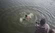 People taking bath at Debar Par Dighi on January 14, 2015 in Agrabad, Chittagong, Banglade...