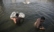 People taking bath at Debar Par Dighi on January 14, 2015 in Agrabad, Chittagong, Banglade...