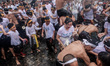 People in Jimbaran Village, Bali held a Siat Yeh (water war) ritual to celebrate the new y...