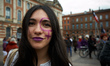 A young woman poses for a portrait. Several thousands of women took to the streets of Toul...