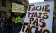 The banner reads 'Angry but not fascist'. For the Act 17 several thousands of protesters c...