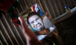 Ram Prashad (34) performs as a joker in a local circus puts make up before the show. On 7...