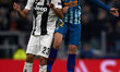 Alvaro Morata of Ateltico Madrid and Emre Can of Juventus competes for the ball during the...