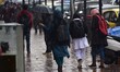 Kashmiri women walk as it rains in Srinagar,Kashmir on March 13, 2019. 
