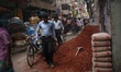 People seen going to their workplace as construction workers working on a road in Dhaka, B...