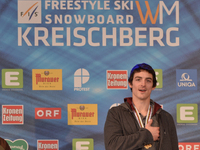 Ryan Stassel from USA, during his country National Anthem as he wins GOLD in Men's Ski Slopestyle, at FIS Freestyle World Ski Championship 2...