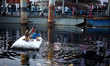 Children seen passing joyful time in Buringanga river, Dhaka, Bangladesh on Friday 22 marc...
