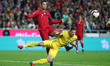 Portugal's forward Cristiano Ronaldo vies with Ukraine's defender Vitaliy Mykolenko during...