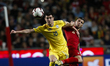 Roman Yaremchuk of Ukraine (L) vies for the ball with Ruben Dias of Portugal (R)  during t...