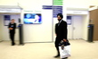 A participant who smiles as he walks is captured during the Annual Meeting 2015 of the Wor...