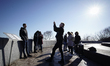 People are seen taking pictures at the Dnipro river observation deck in Kyiv, Ukraine on M...
