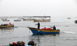 Hunters riding fishing boats inside the port of Gaza