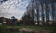 Women sitting in an empty park, in Novara, Italy.  Exporti is a reality tale made up out o...