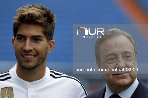 Brazilian soccer player Lucas Silva poses with his new shirt during his presentation as new player of Real Madrid at the Santiago Bernabeu s...