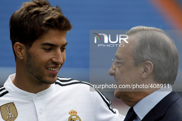 Brazilian soccer player Lucas Silva poses with his new shirt during his presentation as new player of Real Madrid at the Santiago Bernabeu s...