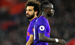 Liverpool forward Mohamed Salah joins the wall during the Premier League match between Sou...