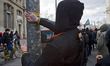 Antifascist militant with sticker against nationalism. 