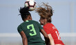 Marvis Ohale of Nigeria and Janine Beckie of Canada competes for the ball during the inter...