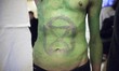 Extinction Rebellion logo painted on the body of eco activists during disrupt Water Expo c...