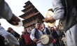 Nepalese devotees playing traditional instruments on a first day of Biska Jatra Festival a...