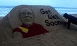 Dalai Lama's sand sculpture is seen at the Bay of Bengal Sea's eastern coast beach carryin...
