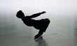 Filipino Olympic skater Michael Martinez is silhouetted during his special performance and...