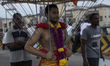 HIndu devotee walk with his 'kavadi' (burden) to the Batu Cave temple during a Thaipusam f...