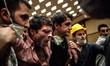 A man suffering from the effects of tear gas is helped inside the Divan Hotel behind Gezi...