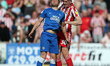 Matt Godden of Peterborough United and Jimmy Dunne of Sunderland during the Sky Bet League...