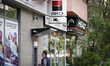 A man uses an ATM at a branch of the BRD bank in central Bucharest, Romania on April 30, 2...