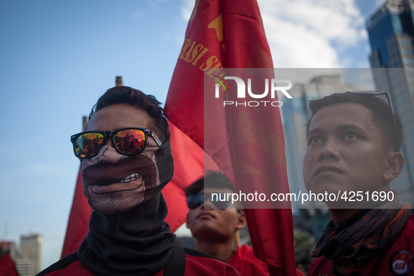 Indonesian workers listen to the oration during May Day rally in Jakarta on May 1, 2019.  Thousands of Indonesian workers are urging the gov...