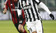 Alvaro Morata and Andrea Poli in action during the Serie A match between Juventus FC and A...