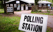 Signs stand outside a polling station in the New Forest District Council town of New Milto...