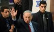 Israeli Prime Minister and leader of the Likud Party Benjamin Netanyahu waves to voters fr...