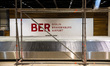 Scaffolds and logo are seen at the construction site of the BER Willy Brandt Berlin Brande...