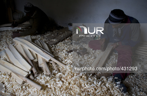 HALMULLAH, INDIAN ADMINISTERED KASHMIR, INDIA - FEBRUARY 11: Workers shape unfinished cricket bats in a cricket bat factory on February 11,...