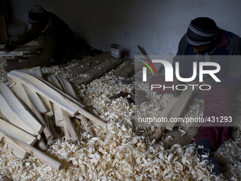 HALMULLAH, INDIAN ADMINISTERED KASHMIR, INDIA - FEBRUARY 11: Workers shape unfinished cricket bats in a cricket bat factory on February 11,...