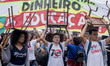 People take part in a demonstration against education cuts and pension reform in Sao Paulo...