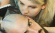 Master tattoos a man's head during the tattoo festival in Kyiv, Ukraine, May 17, 2019. 15t...
