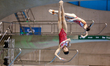 Shan LIN and Yani CHANG of China compete in the Women's 3 meter Synchro Springboard final...