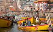 On 18 May 2018, young Indian men sit on a row boat on the Ganges River, which is considere...