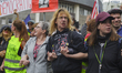 Protesters linked arms at the front of the protest to help the march keep pace and to marc...