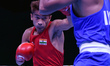 Indias boxer Shiva Thapa (Red) in action in the 60 kg (Men) category against Manish Kaushi...