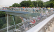 People walk on the newly opened footbridge in Kyiv, Ukraine, May 27,2019 