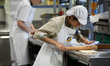 An apprentice prepares the dough. The first World Cup of Chocolatine (French pastry) took...